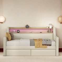 a white day bed sitting in a bedroom next to a wall mounted clock and lamp