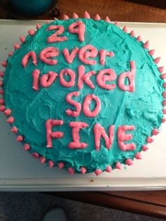 a birthday cake with the words 24 never looked so fine written on it in pink and blue frosting