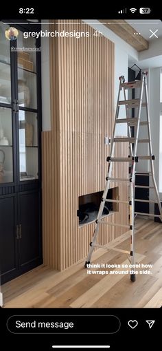 a ladder that is sitting in the middle of a room with wood paneling on it