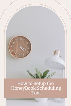 a white desk with a clock on it and the words how to setup the honey book schedule