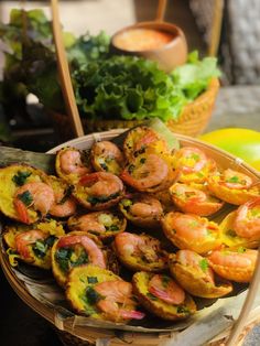 a basket filled with shrimp and other food items