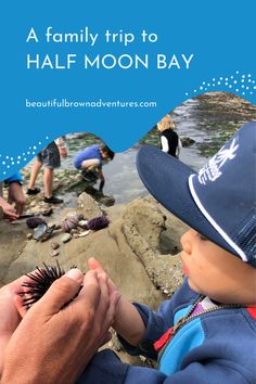 a person holding a baby in their hands with the words, a family trip to half moon bay