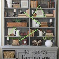 an old bookcase has been decorated with green tape to decorate shelves for books and other things