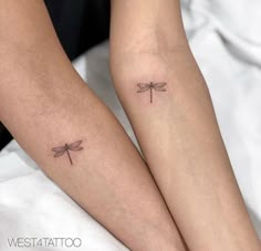 two people with matching tattoos on their legs, one has a dragonfly tattoo on the other