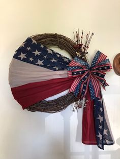 an american flag wreath hanging on the wall