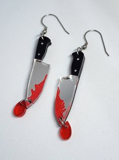 Impress your friends (and, ahem, your enemies) with these unique, handmade Bloody Knife Earrings. Perfect for adding a punk-rock edge to any outfit, they're sure to cause a stir wherever you go! Wear them in style and let your ears do the talking. Horror Earrings Clay, Edgy Handmade Jewelry Gift, Handmade Edgy Jewelry For Gifts, Edgy Handmade Halloween Earrings, Edgy Handmade Earrings For Halloween, Handmade Punk Jewelry For Alternative Fashion, Punk Handmade Jewelry For Alternative Fashion, Handmade Punk Style Dangle Jewelry, Handmade Punk Dangle Jewelry