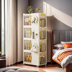 a room with a bed and a white bookcase filled with lots of books on top of it