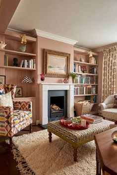 a living room filled with furniture and a fire place