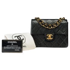 Stunning Chanel Mini Timeless Flap Bag in Black quilted lambskin leather, gold metal chain Intertwined with black leather for hand, shoulder or crossbody Carry Closure: Flap and gold metal turnlock Interior: Burgundy lambskin, 1 flat pocket, 1 zip pocket Signature: "Chanel, Made in France" Date: 1986/1988 Dimensions: 18x14x6 cm (7.1x5.5x2.3 inches) Chain Length: 55 cm (21.7 inches) Reference: 102167 Packaging Hologram: Yes Authentication Card: Yes Dustbag: Yes Box: No General Condition: 7/10 In Chanel Square Mini, Structured Shoulder, Chanel Mini, Mini Shoulder Bag, Black Quilt, Flap Bag, Lambskin Leather, Metal Chain, Fashion Handbags