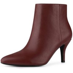 a women's ankle high heeled bootie in brown leather with black rubber soles