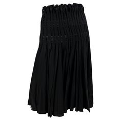 Presenting a black pleated Yves Saint Laurent Rive Gauche skirt, designed by Tom Ford. From the Fall/Winter 2001 collection, this fabulous flare skirt features a high waist and satin ribbons woven between pleats. An incredible early piece of Ford's work while at YSL, this skirt is effortlessly chic and timeless. Approximate measurements: FR36 27.5" waistband 37" hips 27.5" waistband to hem 100% silk Mori Girl Fashion, Satin Noir, Satin Ribbons, Rive Gauche, Mori Girl, Flare Skirt, Black Satin, Tom Ford, The Fall