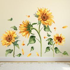 the sunflowers are painted on the wall with green leaves