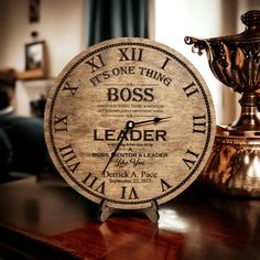 a wooden clock sitting on top of a table