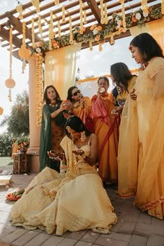 a group of women standing around each other