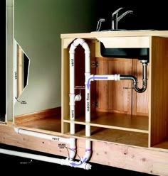 a sink and some pipes in a cabinet with the words, mask requires the horizontal vent must be connected to the wall