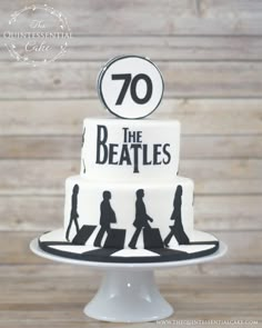 a white cake with the beatles on it