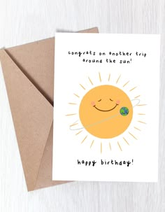 a greeting card with the words congratulations on another trip around the sun, happy birthday