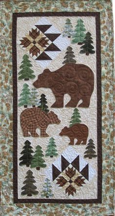 a quilt with bears and trees on it