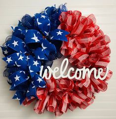 a red, white and blue wreath with the word welcome