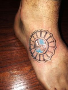 a person's foot with a tattoo on it