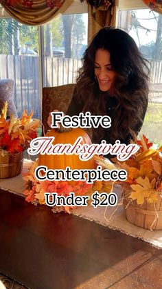 a woman sitting at a table in front of a pumpkin with the words festive thanksgiving centerpiece under $ 20