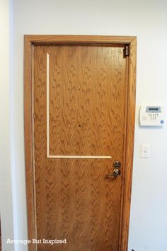 a wooden door with an electrical outlet on the side