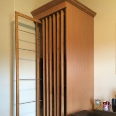 a room with a chair, cabinet and other items