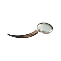 a magnifying glass sitting on top of a wooden stick