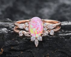 Oval cut pink fire opal main stone with marquise cut moissanite bridal set is unique,dainty,elegant and very stunning! ITEM DESCRIPTION This ring is special for occasion as a gift for girlfriend and wife as anniversary gift, birthday gift, souvenir present. *Material: Sterling Silver,10K 14K 18K Rose Gold, White Gold, Yellow Gold *Shank width: approx. 1.6mm(bottom) *Main Stone: 8X6mm Oval Cut Pink Fire Opal *Accent Stone: 0.18 Carat 5A Cubic Zircon or Moissanite(Solid gold only) *Prong Setting W Pink Opal Wedding Ring, Oval Pink Opal Ring For Wedding, Anniversary Pink Opal Ring, Pink Marquise Cut Wedding Jewelry, Pink Oval Opal Ring For Wedding, Elegant Pink Opal Ring For Anniversary, Rose Gold Pink Opal Jewelry For Wedding, Pink Opal Ring For Wedding, Pink Oval Opal Ring For Gift