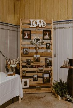 a wooden pallet with pictures on it and the word love spelled out in white