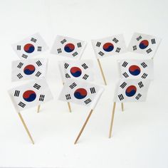 several small flags are placed on toothpicks in the shape of south korean flags