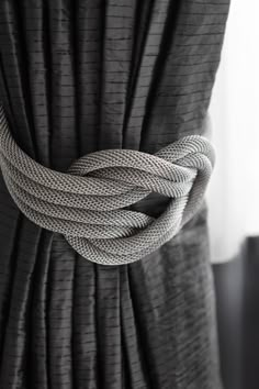 a close up of a curtain with a knot on it