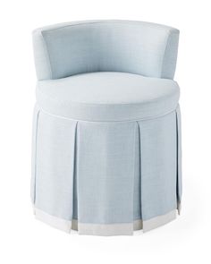 an upholstered chair with pleated skirting on the front and back legs