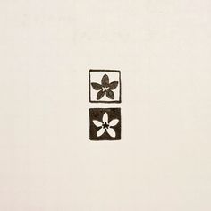 a black and white drawing of a flower on a wall