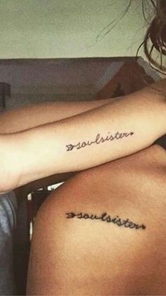 two girls with tattoos on their arms and one has the word together in cursive writing