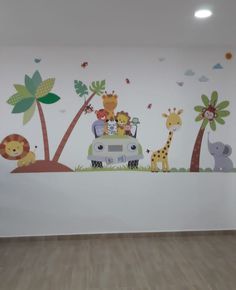 a wall with animals and giraffes on it