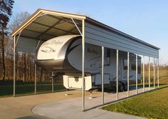 an rv is parked under a metal awning