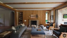 a living room filled with furniture and a fire place