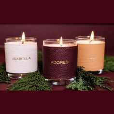 three candles sitting next to each other on a table