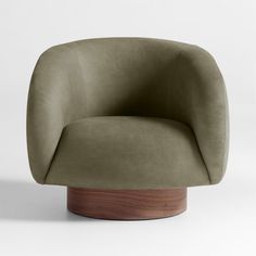 an olive green chair with wooden base and rounded backrest, viewed from the side