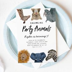 an animal themed birthday party card on a plate