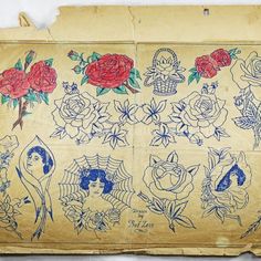 an old piece of paper with roses and other tattoos on it, sitting on a table