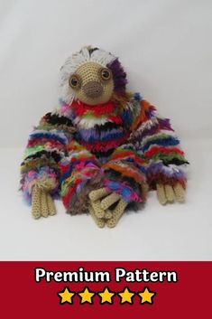 a stuffed animal with multicolored feathers sitting on top of a red and white background