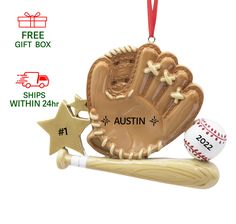 an ornament with a baseball, glove and bat on it's side