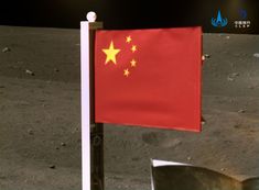 the chinese flag is on the surface of the moon