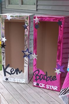 two cardboard boxes decorated with stars and the words ken, barbie, rock star on them