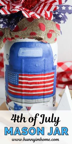 a mason jar decorated with red, white and blue decorations for the fourth of july