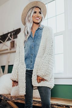 If you are someone who "craves coziness," then this adorable ivory colored cardigan is PERFECT for you with its soft thick tight knit material with ribbed texturing, long loose sleeves with flared cuffs, and an ultra relaxed open front silhouette that falls into a straight mid-thigh length hemline! You can wear this versatile piece with just about anything from a basic tank to a sweater, jeans to skirts or dresses, booties to wedges or sandals, clutches to totes, and hats to earrings! Cream Cardigan Outfit Winter, Ivory Cardigan Outfit, Cardigan Outfit Winter, Chunky Cardigan Outfit, Cardigan Outfit Casual, Cream Cardigan Outfit, Winter Cardigan Outfit, Knit Cardigan Outfit, Cardigan Outfit