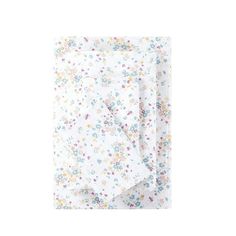 a white sheet with colorful flowers on it