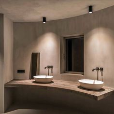 two white sinks sitting on top of a counter